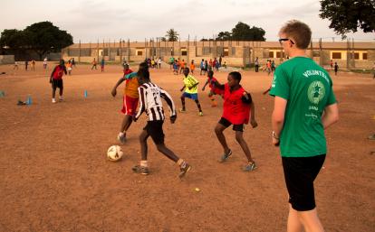 A Projects Abroad volunteer work with teens to teach football in Ghana. A Projects Abroad volunteer work with teens to teach football in Ghana.